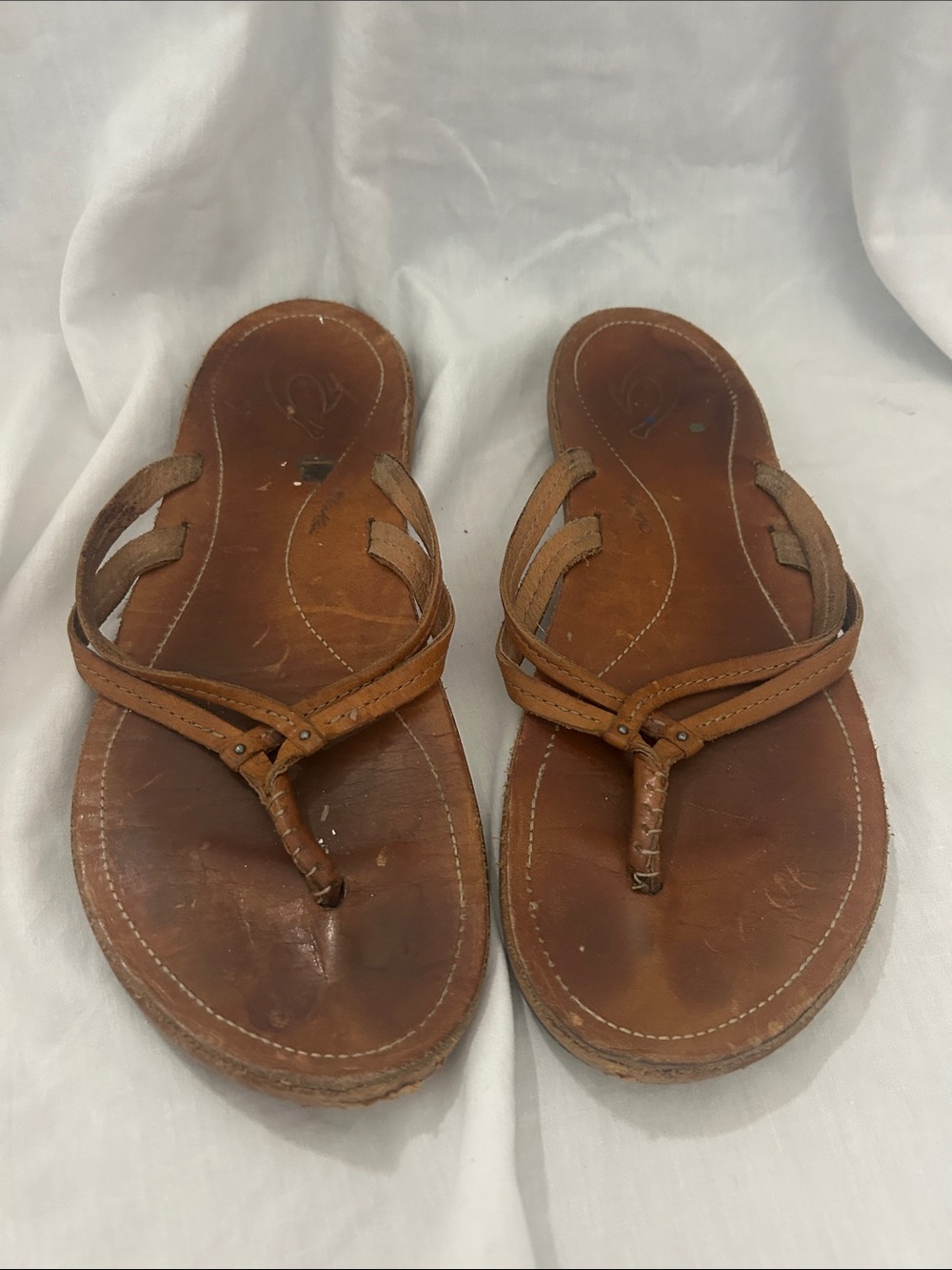 OluKai Women’s leather flip flops